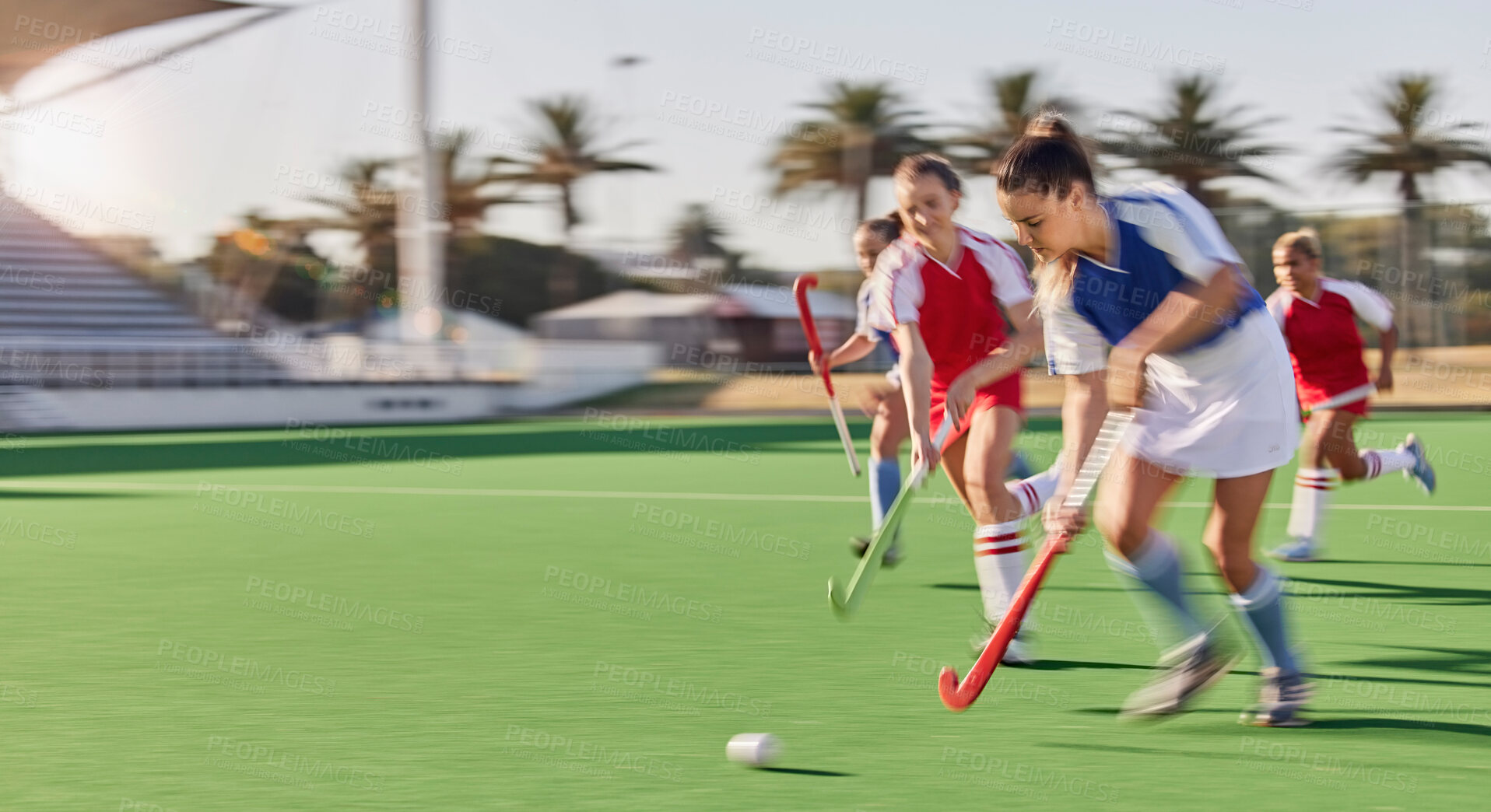 Buy stock photo Sports, hockey and women in action on field playing game, match and training in outdoor stadium. Fitness, exercise and blur of female athletes running with speed for victory, winning and score goal