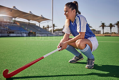 Buy stock photo Sports, hockey and woman relax on field during match, thinking and planning a game strategy. Field hockey, coach and girl with stick, athletic and mindset at stadium for training, exercise and sport