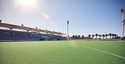 Buy stock photo Empty sport field, outdoor grass and training stadium ground in summer ready for sports. Lawn care, sunshine and blue sky by a exercise, workout and game venue isolated and remote for fitness