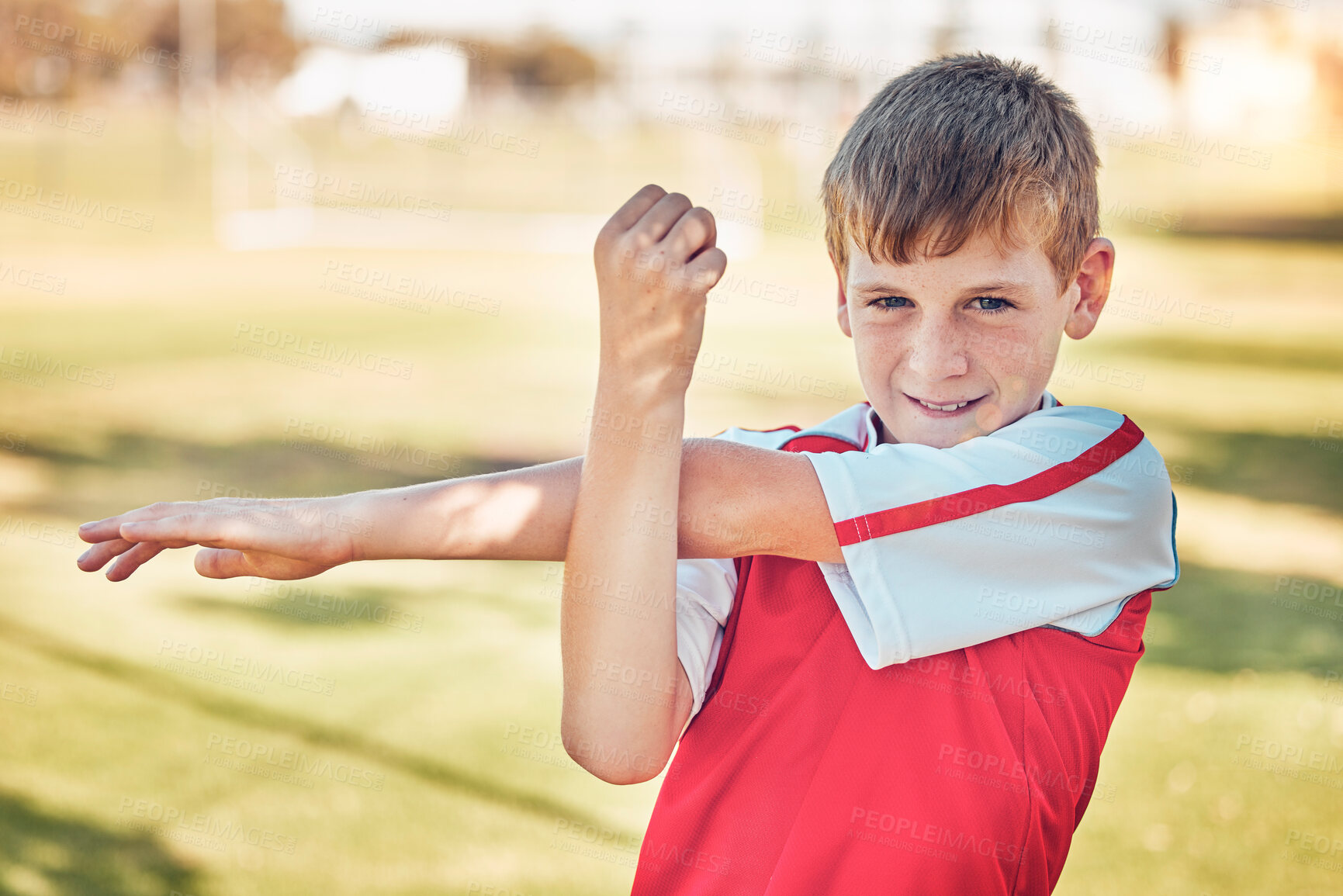 Buy stock photo Soccer field, boy and kid stretching exercise, workout and training on grass field, pitch or park outdoors. Young child, football player and warm up in sports games, performance and youth competition