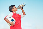 Training, sports and football with child drinking water for fitness, health or endurance exercise. Wellness, summer and workout with young soccer player and bottle for electrolytes, relax and thirsty