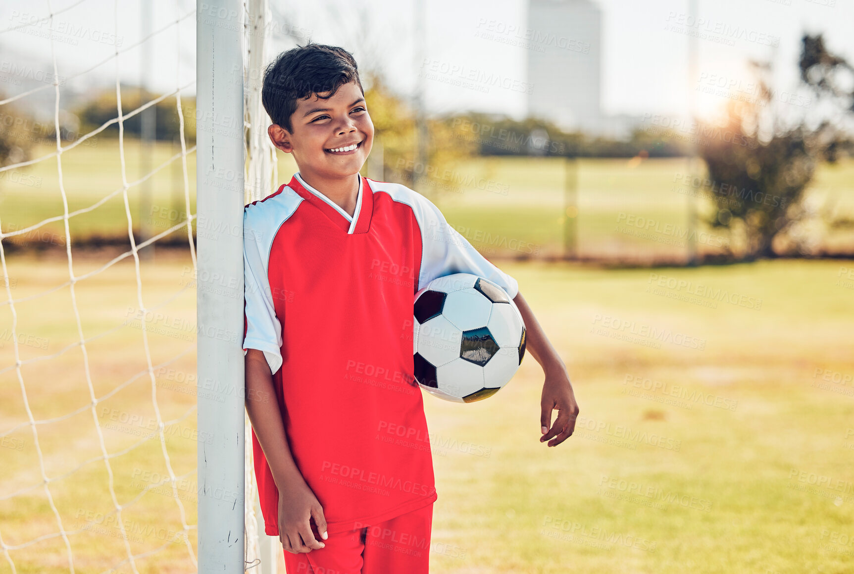 Buy stock photo Soccer player, field and child with happy game, competition or training on pitch near goal post with fitness health. Kid with soccer ball thinking on a football field for exercise, workout or sports