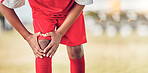 Sport, knee injury and soccer player on field, fitness and athlete have pain with exercise and medical emergency. Soccer, accident in game and sports training, muscle ache and active lifestyle.