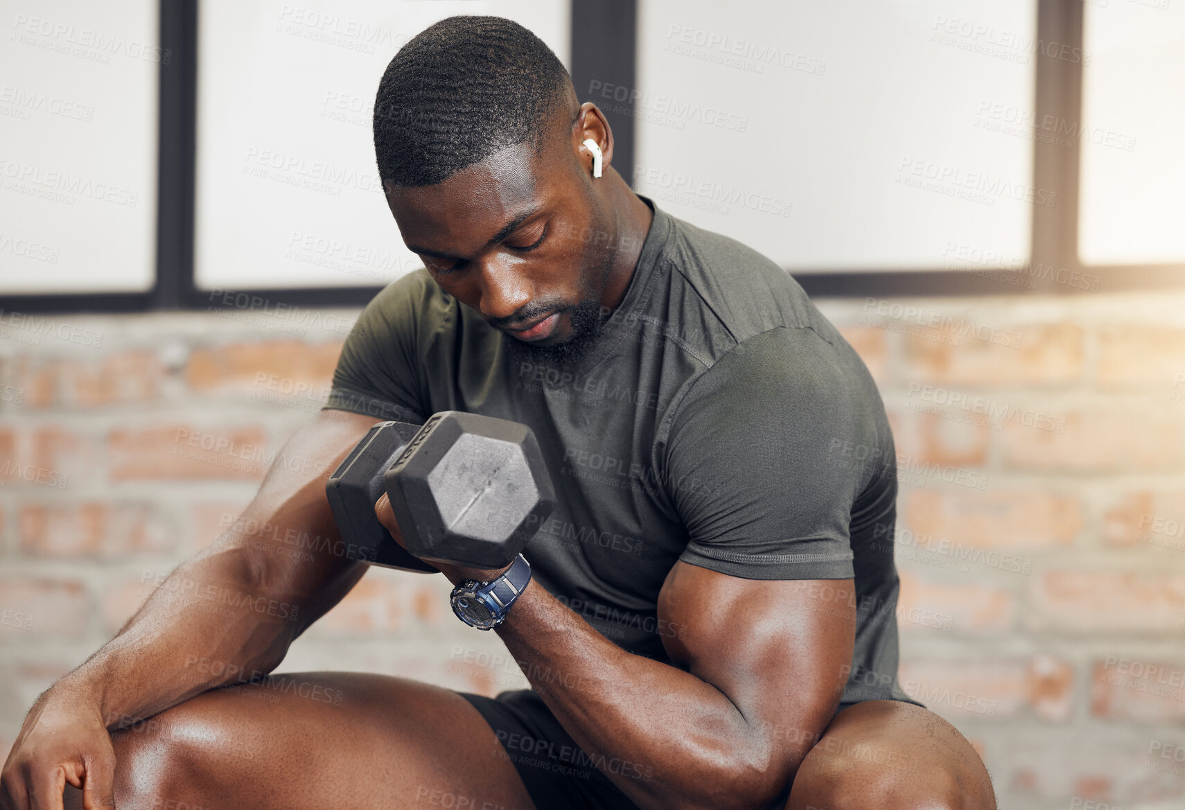 Buy stock photo Fitness, body builder and black man with dumbbell training, workout or challenge exercise with muscle power, energy and music. Strong, audio and sports person listening for bodybuilder motivation