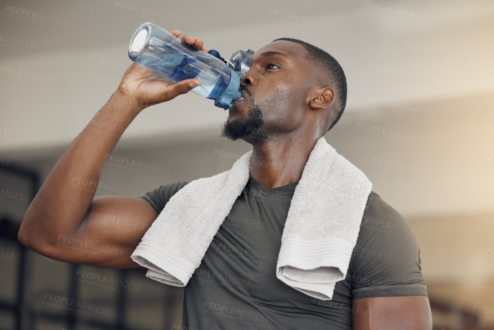 Buy stock photo Fitness, gym and black man drinking water after workout or training for hydration, health or wellness. Strong, healthy and African athlete enjoying a beverage after intense exercise at sports center.