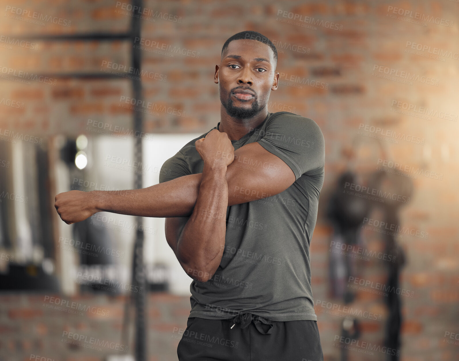 Buy stock photo Black man, bodybuilder and stretching in gym for fitness, health or exercise with muscle, arms or focus. Man, strong or warm up for workout, training or performance for healthy body, wellness or life