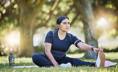 Buy stock photo Woman, fitness stretching and nature park listening to music after a runner exercise and sports. Real plus size athlete from India stretch legs ready for wellness, health workout and running on grass