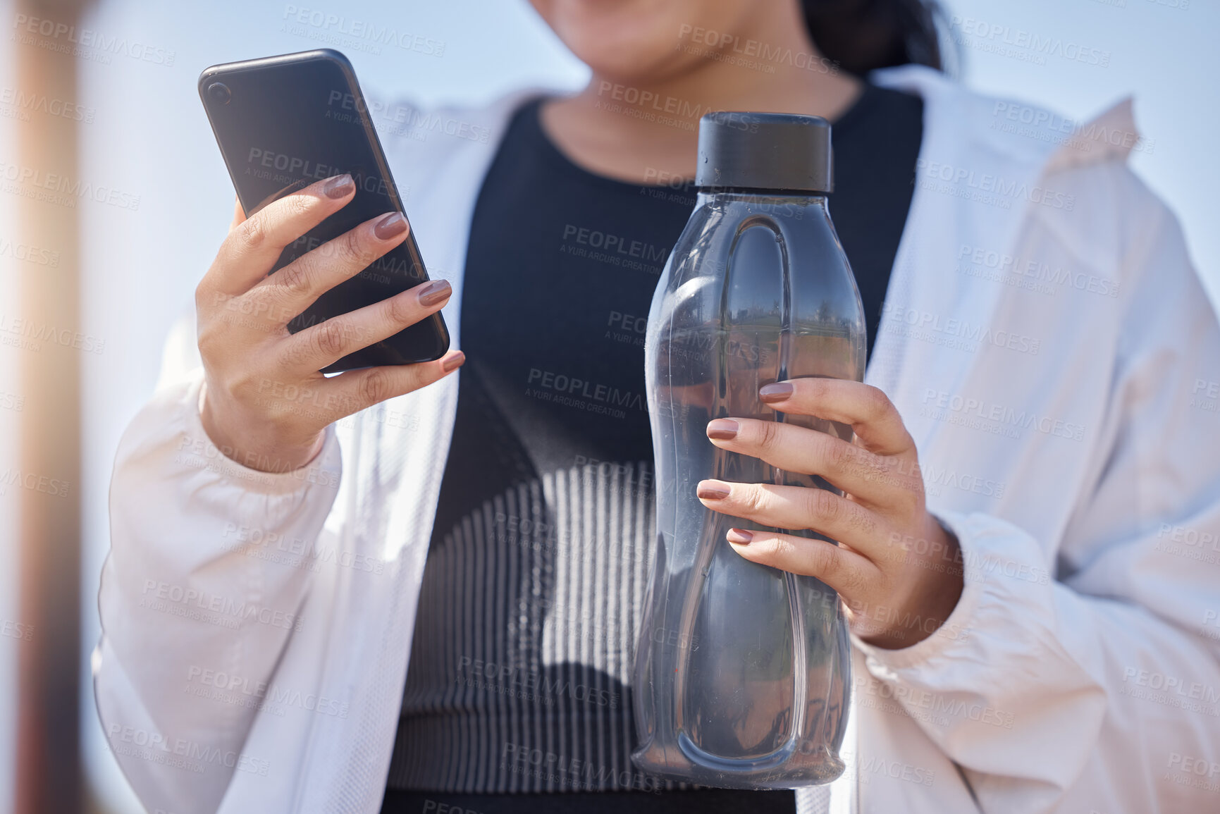 Buy stock photo Exercise, phone and water for woman using fitness app to check progress, steps and health while outdoor for workout, running and training. Athlete runner with bottle and smartphone for social network