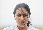 Rain, fitness and portrait of woman in training resting on a workout break outdoors in nature for weight loss. Runner, winter and healthy Indian girl sweating in raining weather after sports exercise