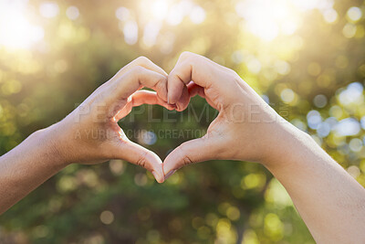 Buy stock photo Heart, love and hands sign at a park, nature and trees bokeh sunshine for earth day, outdoor wellness and healthcare. Support, community and volunteer hand icon for clean green environment in summer