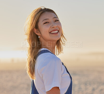 Buy stock photo Happy, asian woman and portrait smile on the beach for fun, travel or vacation trip in the outdoors. Japanese female smiling for joyful holiday walk or traveling in happiness by the sandy ocean coast