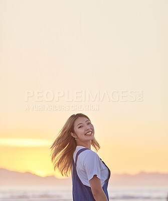 Buy stock photo Travel, sunset and smile with asian woman at beach with mockup for summer, freedom and vacation. Happy, heath and wellness with girl and relax by the ocean for peace, nature and sky on holiday 
