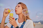 Asian summer, woman with bubbles and blow liquid soap with lips in outdoor nature freedom with beauty face. Young girl playing with party toy, fun magic on beach mockup and blonde hair in Seoul wind
