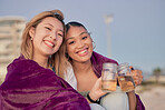 Friends cheers, blanket and relax together in nature for quality time or freedom bonding outdoors. Girlfriends, happy and toasting happiness, love and celebration portrait for memories with drink
