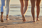People feet, sand and walking on beach steps in summer vacation, holiday and sea travel together outdoors. Closeup group of friends, people and legs, foot and relax on ocean shore, freedom and calm