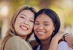 Friends, hug and love outdoor in nature park for fun, support and bonding outdoor with a smile, happiness and trust. Face portrait of asian and black woman lesbian, couple outdoor for travel and fun