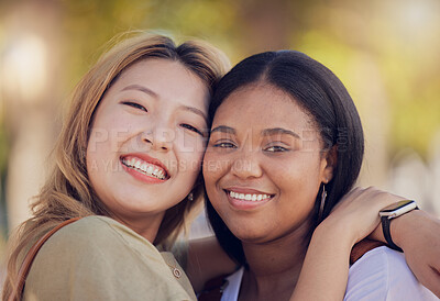 Buy stock photo Friends, hug and love outdoor in nature park for fun, support and bonding outdoor with a smile, happiness and trust. Face portrait of asian and black woman lesbian, couple outdoor for travel and fun