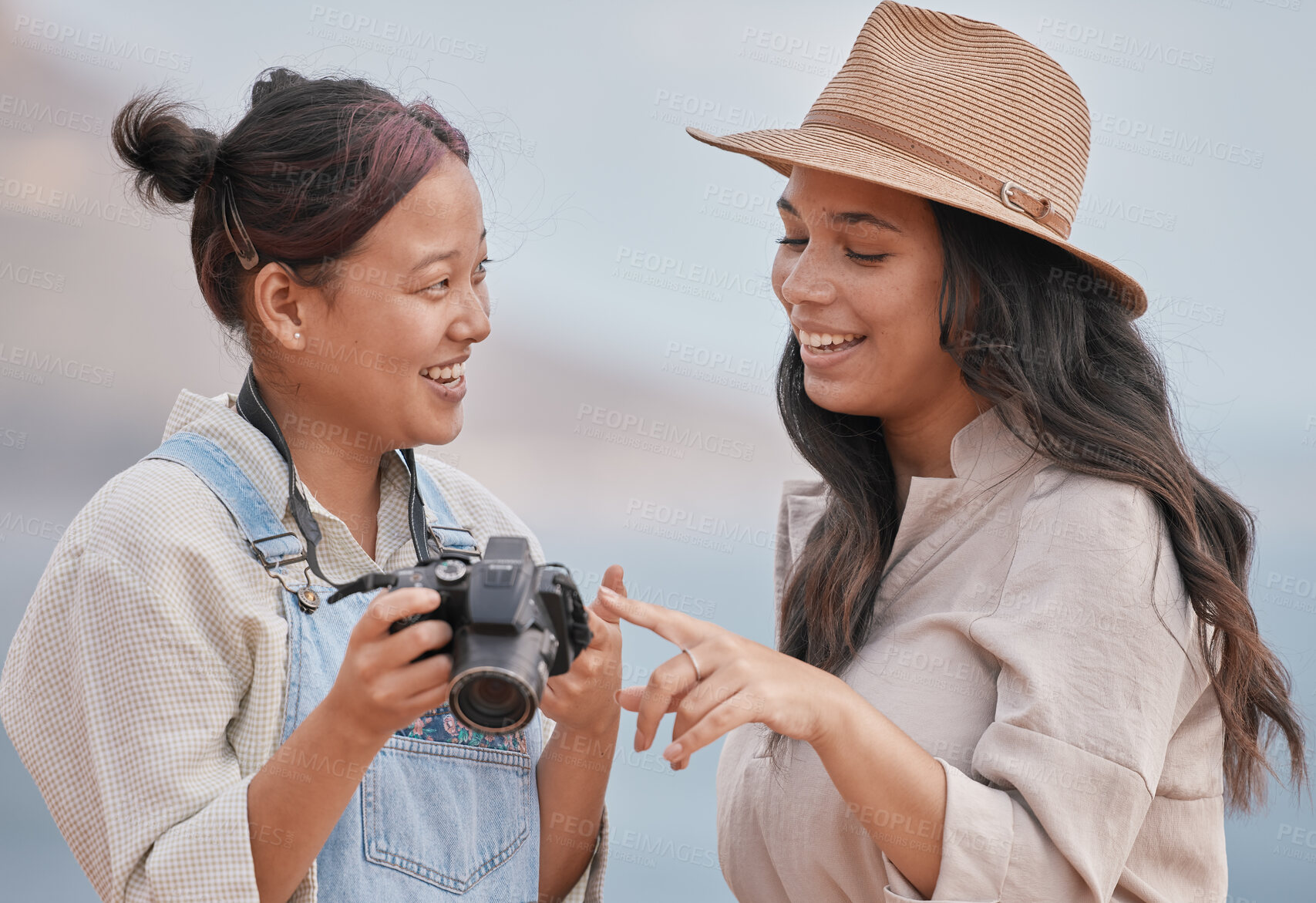 Buy stock photo Photo, photographer and model with a camera for a photo shoot at the beach, nature or during travel of Portugal together. Decision, choice and friends happy with outdoor photography on vintage camera