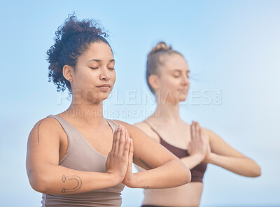 Buy stock photo Yoga, meditation and women with exercise in nature to relax, breathe and care for their mind. Fitness, motivation and friends training for wellness and hope with spiritual workout against a blue sky 