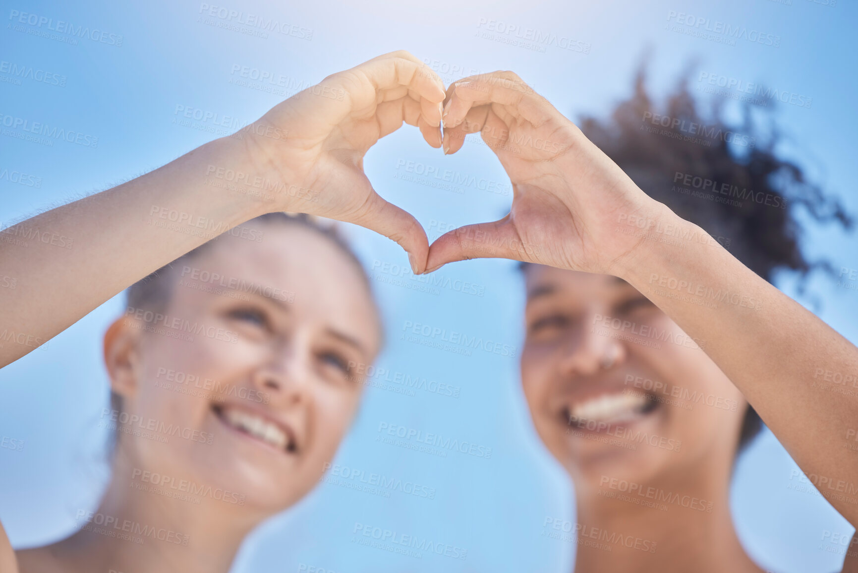 Buy stock photo Friends, smile and heart hands on blue sky, women happy together with love and support in summer sun. Woman, girl friend and happiness, hands join to heart sign for friendship, solidarity and trust.