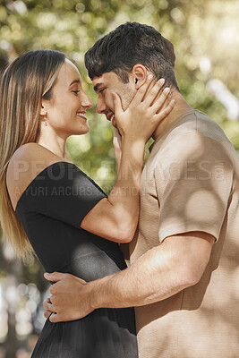 Buy stock photo Love, couple and hug with romance outdoor, bonding and care with happiness and spending quality time together. Happy, man and woman embrace with smile in park, commitment and romantic date.