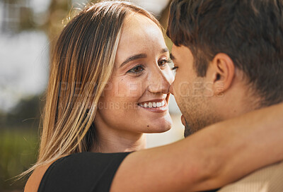 Buy stock photo Love, couple and hug with kiss, smile and bonding together for relationship, marriage and happy. Romance, man and woman being intimate, embrace and romantic for happiness, connect and quality time.