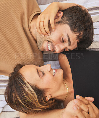 Buy stock photo Top view, love and couple looking happy, smile and together for bonding, romance or relationship. Romantic, man and woman being loving, happiness or intimacy for affection, dating or content to relax