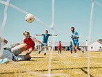 Soccer, children and sports with a boy team playing a game on a grass pitch or field for competition or fun. Football, fitness and training with kids outdoor to play a competitive sport match