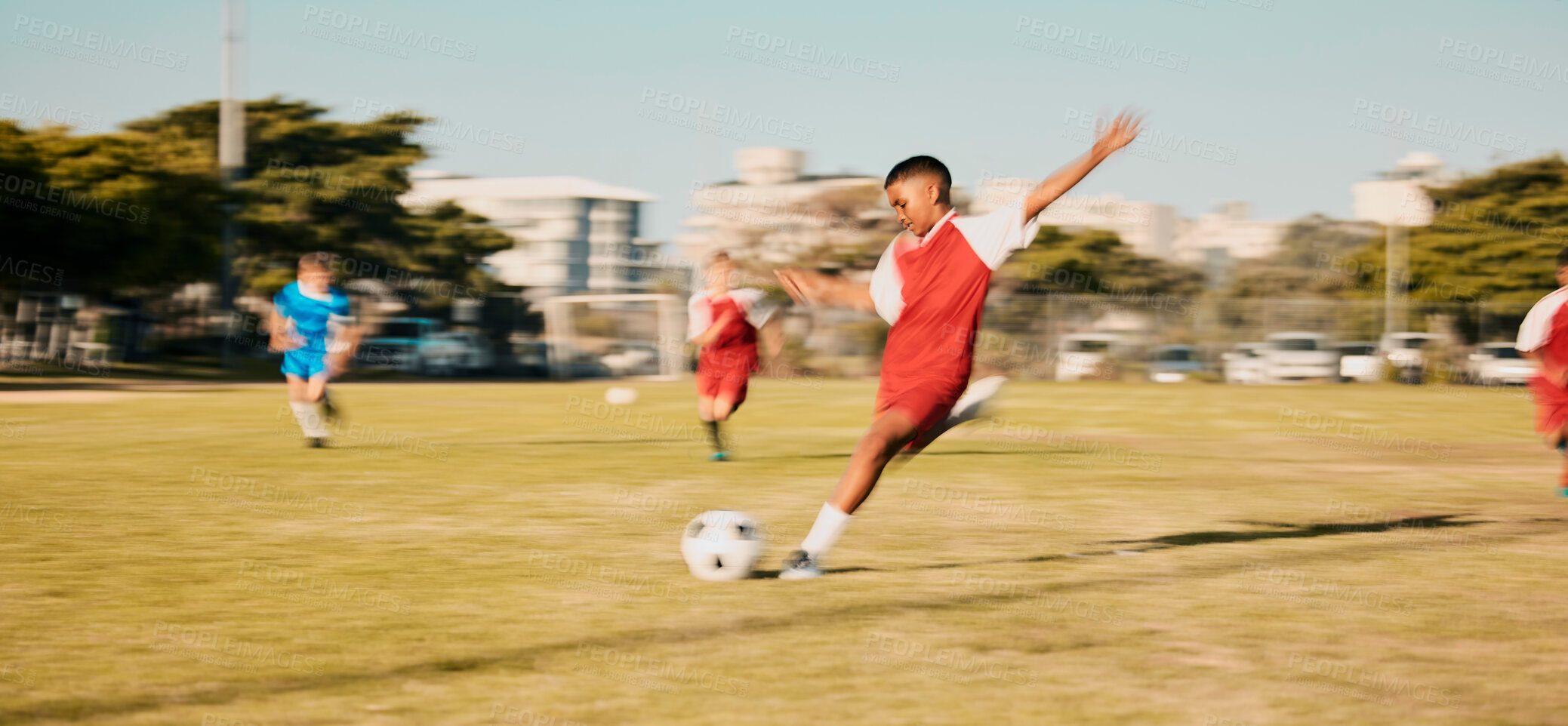 Buy stock photo Sports game, soccer and child shooting, kick or strike ball to score winning goal in contest, competition or match. Fitness workout, training exercise or youth soccer player playing on football field