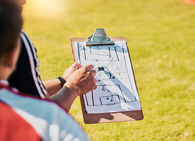 Buy stock photo Clipboard, game planning and on field for soccer, sports and outdoor for competition with coach. Football, strategy and communication for instructions, talking and paper for match day formation.