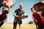 Coach, soccer and team strategy on field for athlete children excited for training game together. Planning, teamwork and football coaching professional on sports ground happy with communication.