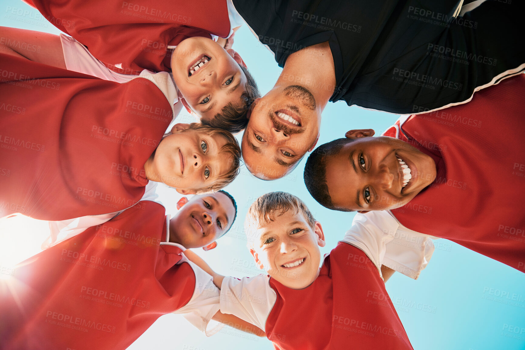 Buy stock photo Football, sports and group children in circle for game strategy, teamwork and collaboration planning together with coach. Coaching, training and soccer player kids for support, communication and talk