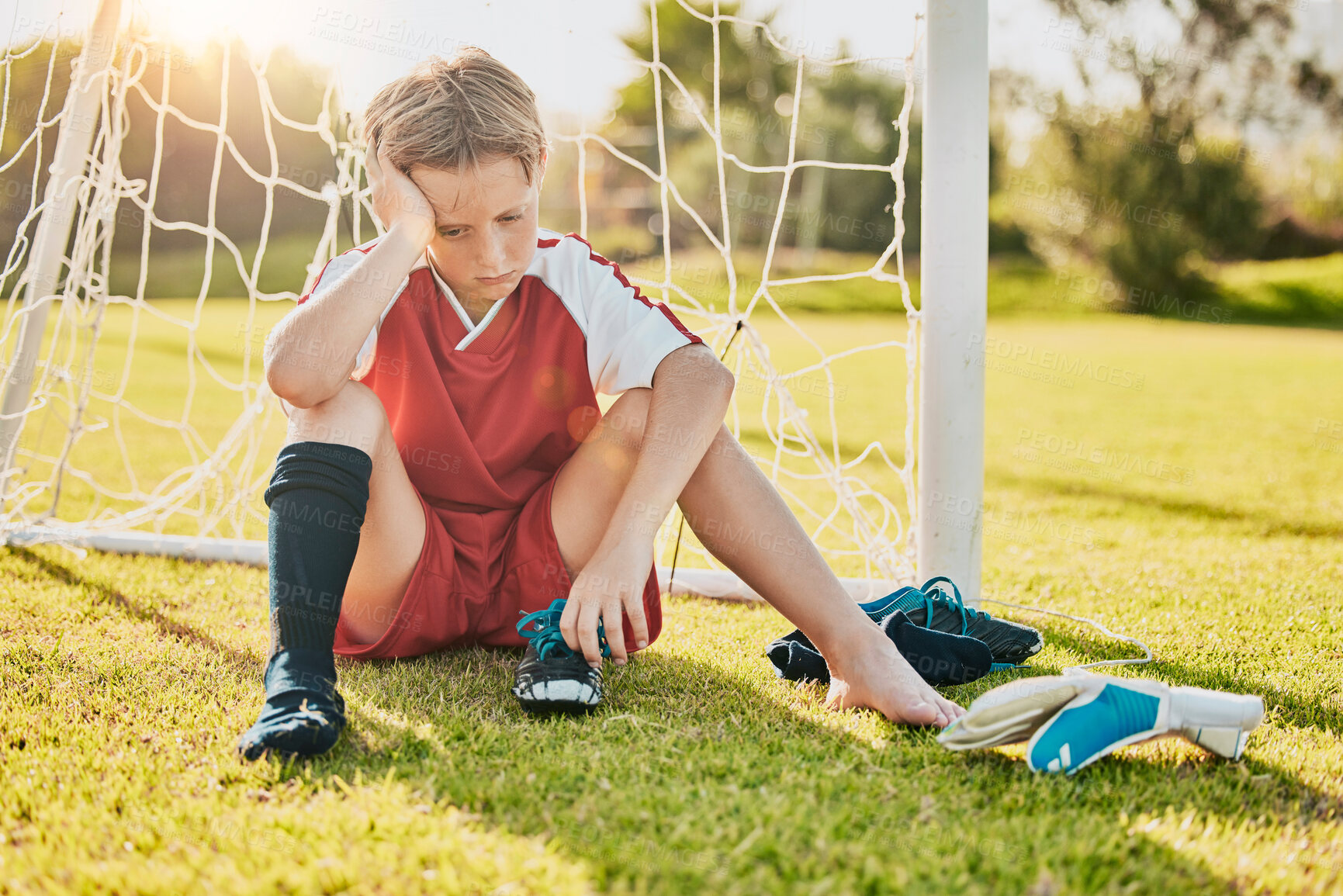 Buy stock photo Sports, football loss and child sad over fitness game defeat, training competition fail or athlete contest. Kid depression, mental health problem and youth player depressed from soccer field bullying