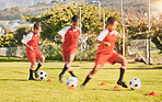 Soccer, football and kids training on soccer field for game, match or competition. Health, teamwork and boy soccer players outdoors on grass pitch for soccer ball practice, drill or skills exercise.