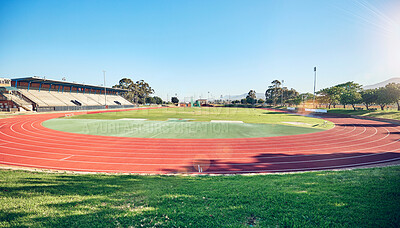 Buy stock photo Sport, fitness and stadium track for running, outdoor and exercise landscape, blue sky and grass. Active, workout motivation and run for healthy life and sports view sun flare with cardio.