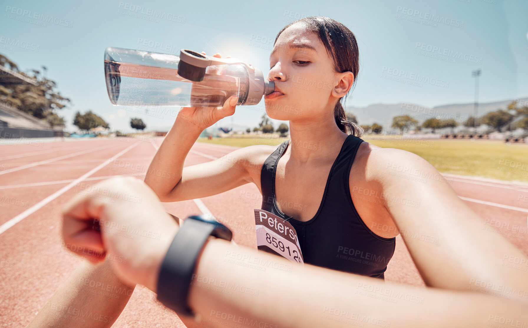 Buy stock photo Woman, drinking water or checking smart watch on running track workout, training or exercise break. Runner, sports athlete or fitness person with smartwatch health or time tracker for health or speed