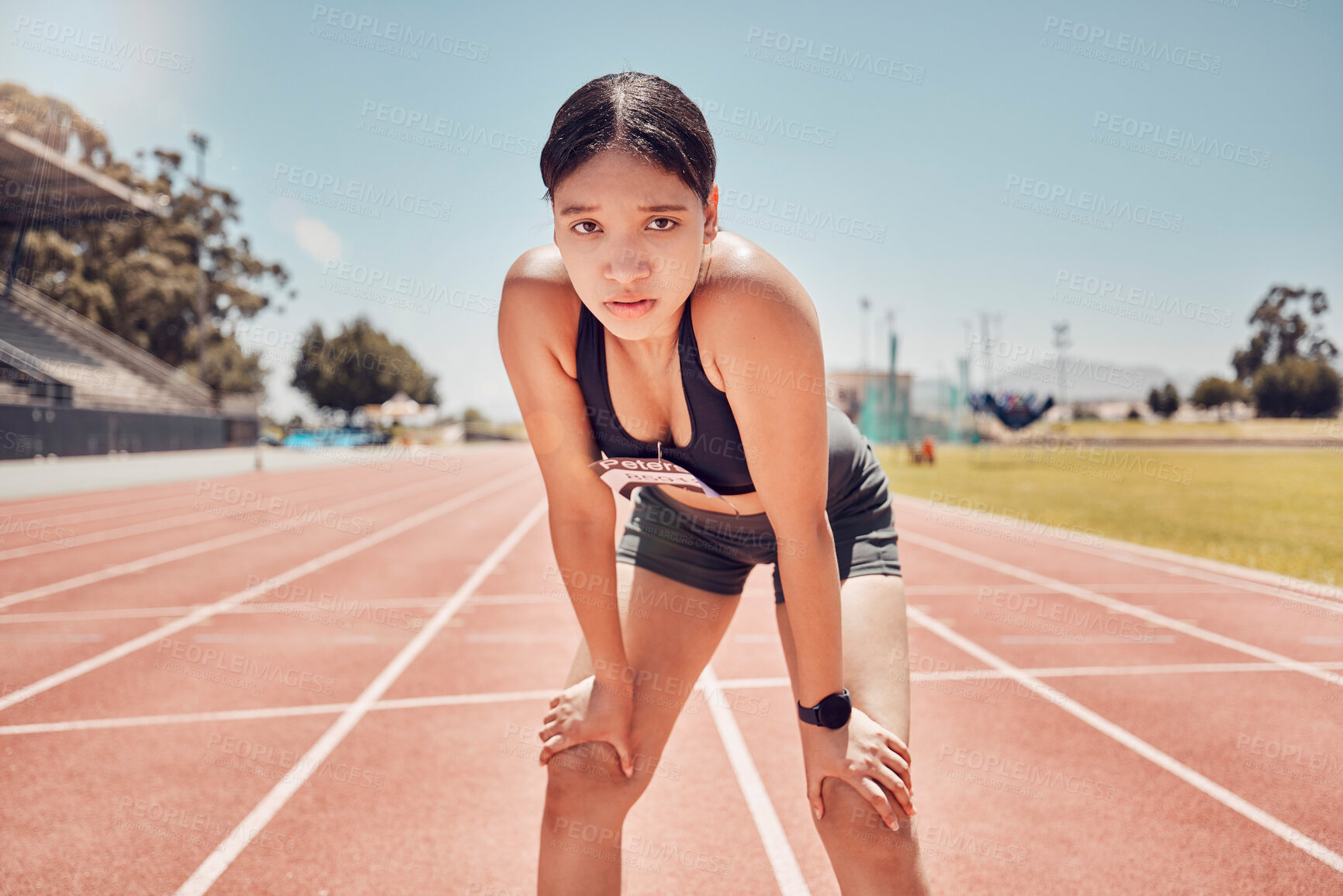 Buy stock photo Sports, stadium and runner woman in portrait for fitness, training and competition with blue sky mock up. Young athlete girl with exercise, wellness and goals for marathon or a race track event