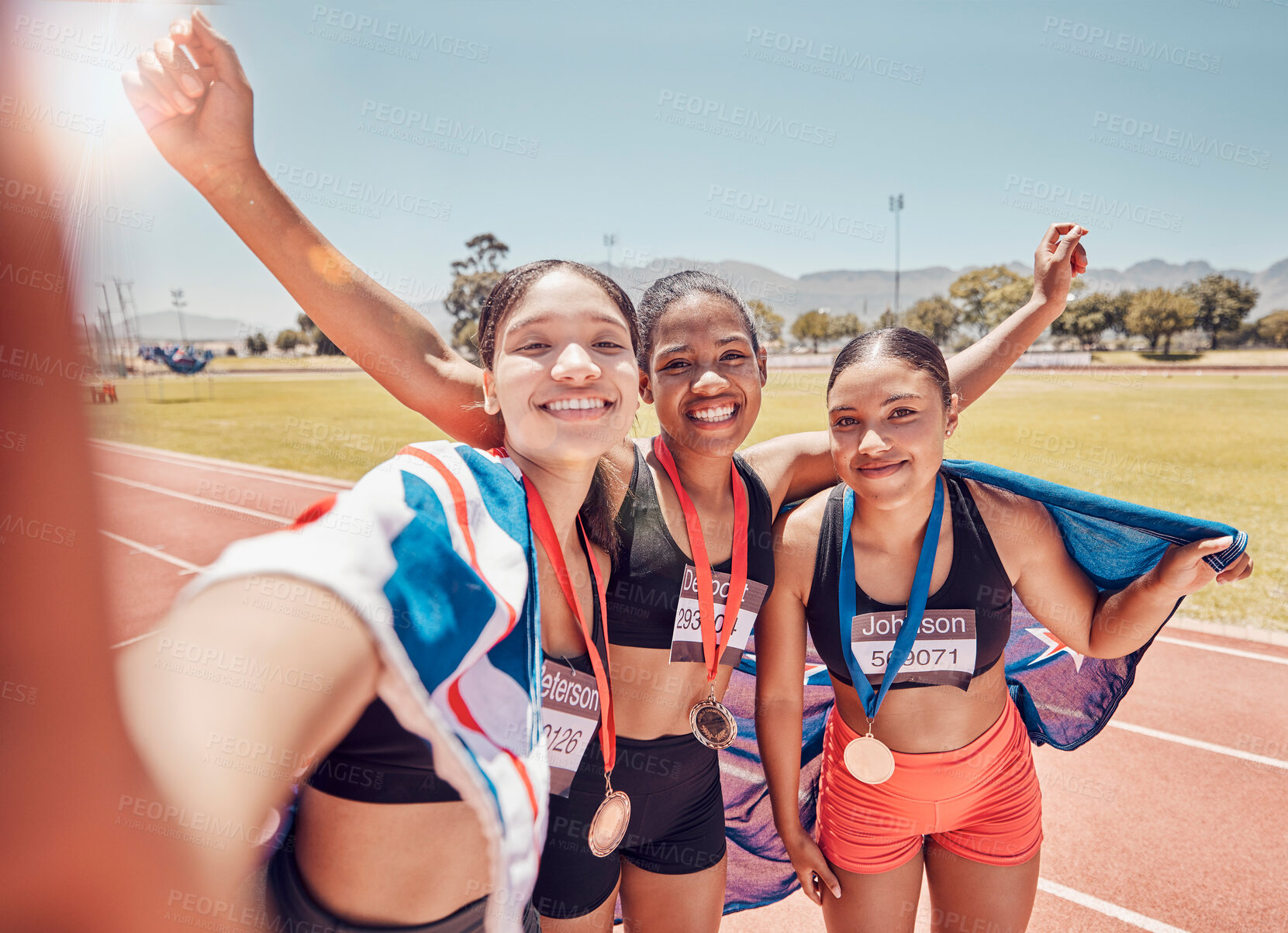 Buy stock photo Selfie, medal and friends with a British flag after running, fitness and sports at a stadium. Collaboration, winning and women athlete group with a photo after achievement in sport or marathon