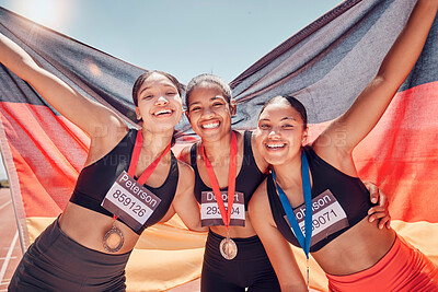 Buy stock photo Award, running and team of women with flag of Germany for winner, gold medal or training in stadium racetrack event. Fitness, goals or sports with portrait of girl runner for global marathon champion