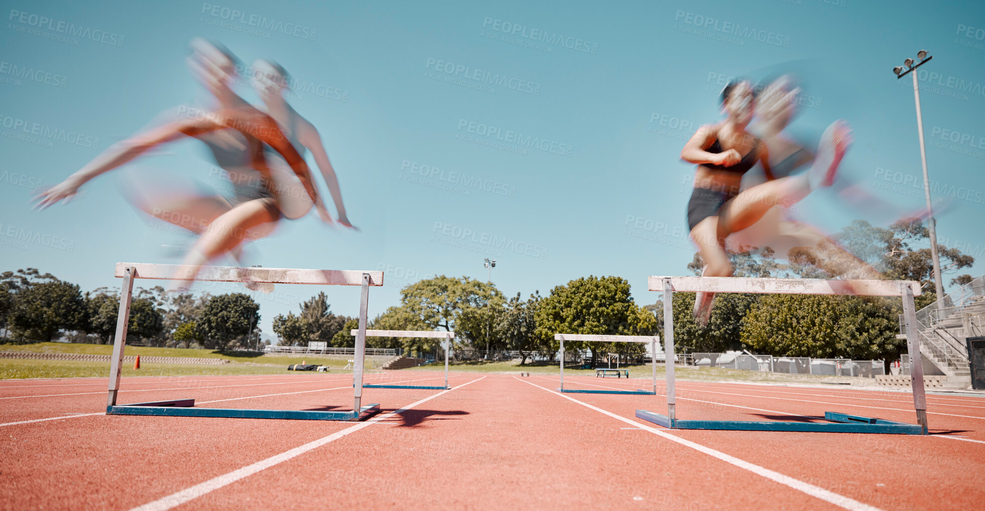 Buy stock photo Fitness, jump or running women in a hurdles sports competition or athletes racing event with speed. Training, exercise and fast girl sprinters jumping in a track and field race at a runners stadium