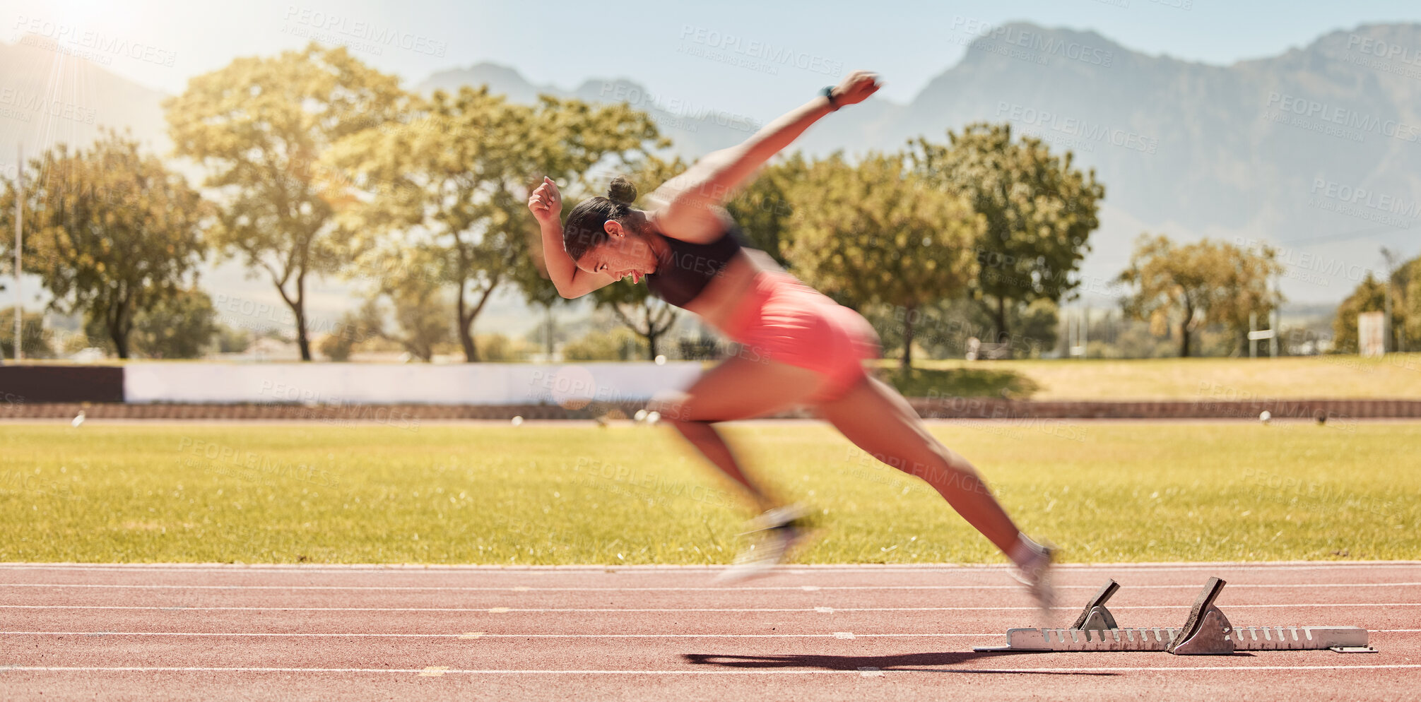 Buy stock photo Sprinting, sports and woman training at a stadium for fitness, exercise and cardio with energy. Running, speed and athlete runner moving with power, fast and action for a race or competition