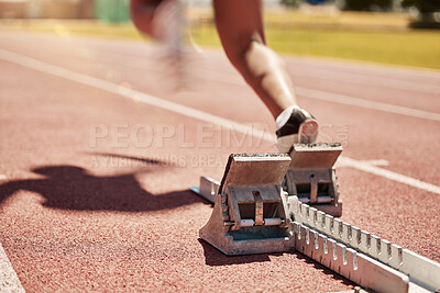 Buy stock photo Sports, fitness and running with a start block on a track for a competitive race in a stadium or arena. Health, workout and exercise shoes with a runner at the beginning of a sport competition