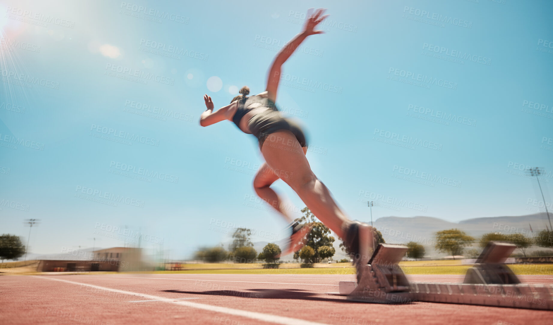 Buy stock photo Speed, track start and woman running for marathon race  workout, fitness or exercise for leg power action. Health commitment, blue sky flare and fast sports girl, athlete or cardio runner training