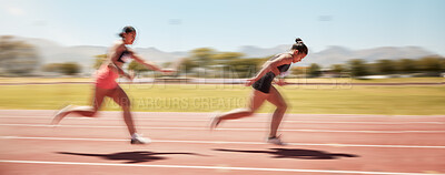 Buy stock photo Sports, fitness and relay race with a woman athlete passing a baton to a teammate during a track race. Running, teamwork and health with a female runner and partner racing for competitive sport