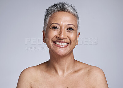 Buy stock photo Face, beauty and skincare with a mature woman in studio on a gray background for natural antiaging care. Portrait, luxury and skin with a female model posing to promote wellness or cosmetic product