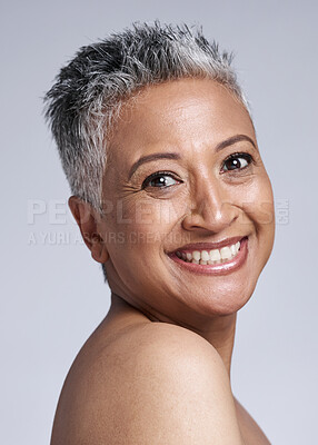 Buy stock photo Wellness, portrait and elderly face beauty with smile of mature woman for healthy cosmetic marketing. Happiness, health and senior model satisfied with natural facial skincare in gray studio.

