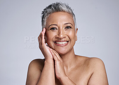 Buy stock photo Portrait, beauty and healthy skincare for mature woman and happy with cosmetic dermatology treatment on a grey studio background. Healthy skin and senior female content with fresh, glowing skin