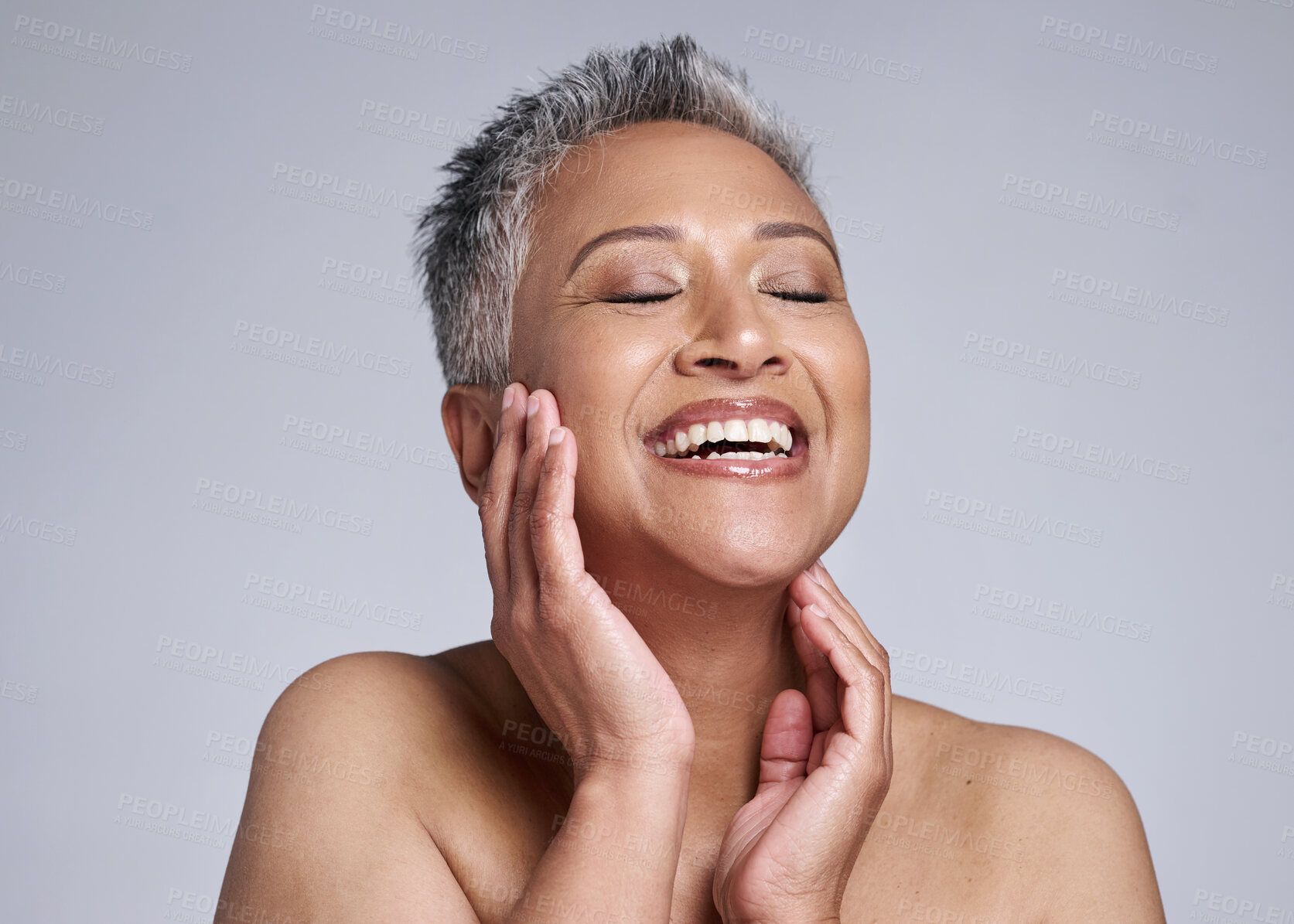 Buy stock photo Beauty, face and happy mature woman, glowing skincare and dermatology of anti aging cosmetics on grey studio background. Smile, joy and wellness of lady model with confidence, happiness and self care