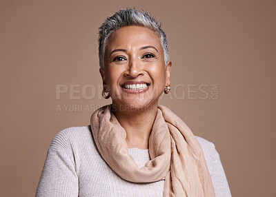 Buy stock photo Face, fashion and beauty with a senior woman in studio on a brown background to promote contemporary style. Portait, fashionable and trendy with a mature female posing to model a clothes brand