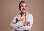 Happy elderly woman, smile and arms crossed in satisfaction for dental care against a studio background. Portrait of senior female smiling with teeth for oral, mouth or gum care hygiene on mockup